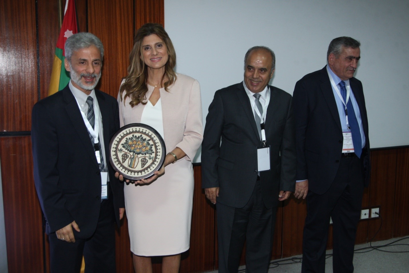 Her Highness Princesses Dina Mired of Jordan, the Conference Patron, awards Dr. Al-Delaimy the Conference plaque for his effort in co-leading the organization of the 2017 2nd National Global Mental Health Conference to the left of her is President of the University of Jordan and the Dean of School of Medicine.